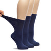 Three pairs of navy blue socks on a white background