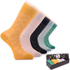 This image showcases a collection of six pairs of Bamboo Dress Funky Socks, each pair boasting a colorful and eye-catching design.