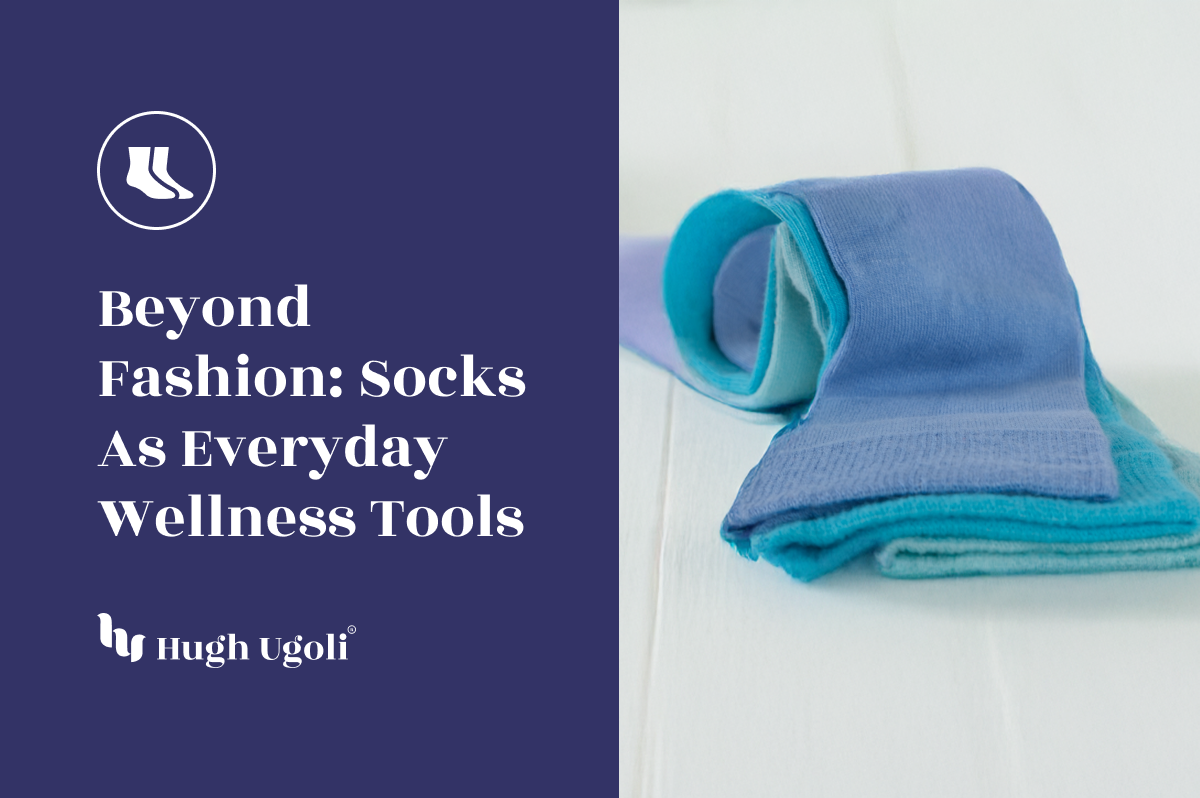 Blue socks on a white surface with text about socks as everyday wellness tools by Hugh Ugolf.