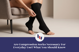 Person putting on black compression socks while seated, illustrating everyday compression sock use and lower leg support