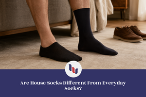 Comparison between no-show and crew socks worn together indoors to illustrate different sock styles.