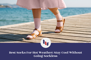 Person wearing white socks and brown sandals on a wooden dock by the ocean.