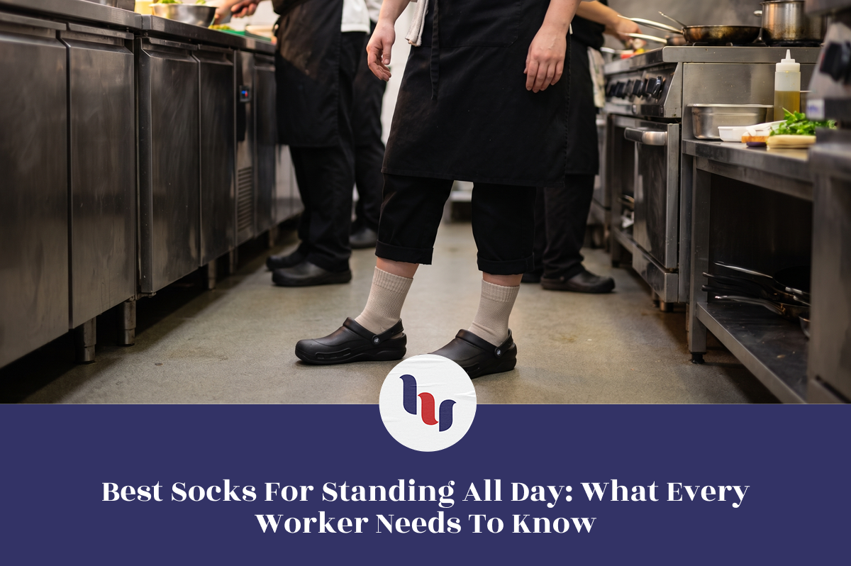 Worker standing in a commercial kitchen wearing crew socks and work shoes