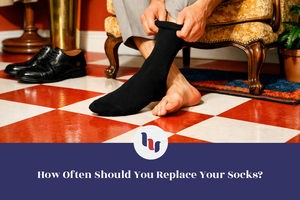 Person putting on a black sock with text about sock replacement frequency.