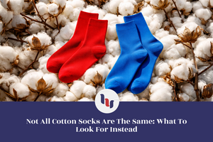 Red and blue socks on a bed of cotton with a visible brand logo.