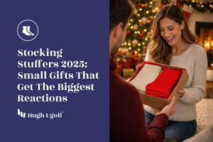 Woman receiving a gift from a man in a festive setting with Christmas decorations.