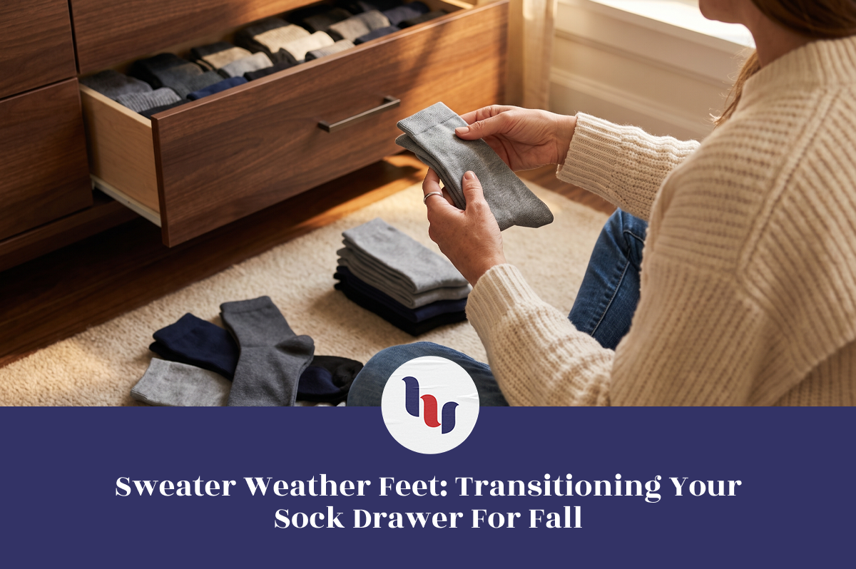 Woman organizing gray socks beside an open sock drawer for the fall season.