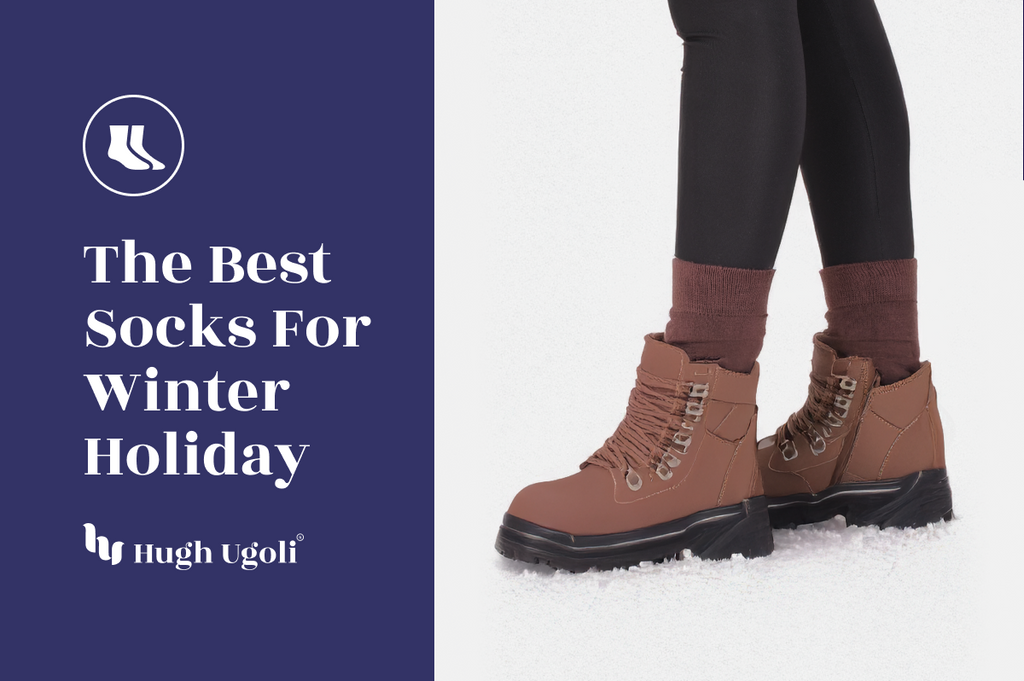 Brown winter boots with socks on a snowy ground, featuring Hugh & Goliath branding.