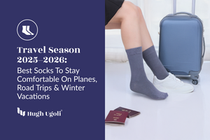 Person wearing gray socks with a blue suitcase and travel documents, promoting Hugh Ugolf's best socks for travel.