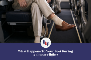 Airline passenger wearing light-colored socks and loafers during a long flight.