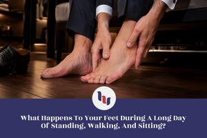 Person massaging tired feet after wearing dress shoes throughout the day.