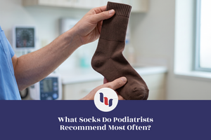 Healthcare professional holding a crew sock for foot care.