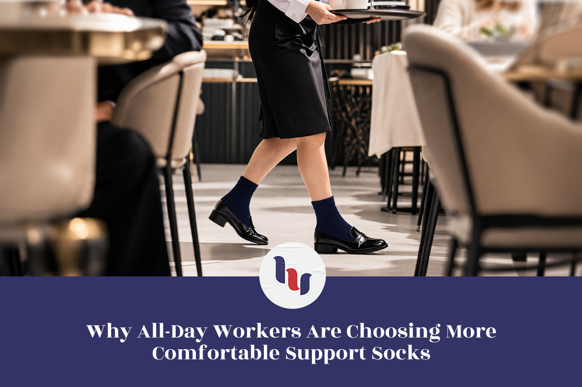 Person walking in a restaurant wearing comfortable support socks with a blue banner and logo at the bottom.
