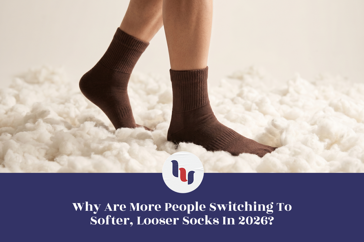 Person wearing soft brown crew socks standing on a fluffy white surface, highlighting comfort and the trend toward looser-fitting socks in 2026