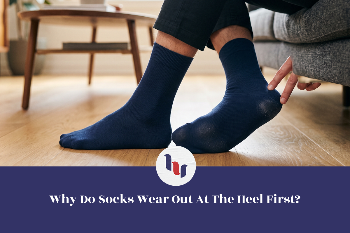 Navy crew sock showing visible heel wear from everyday use.