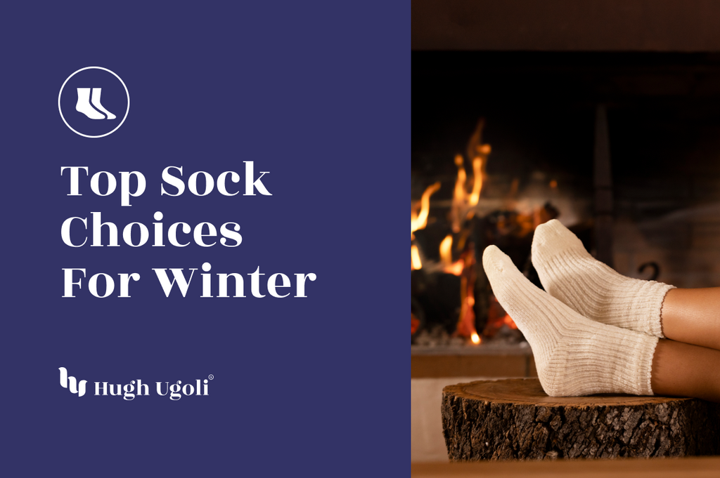 Cozy cream-colored socks on a person’s feet propped up in front of a warm, glowing fireplace, evoking a relaxed winter atmosphere.