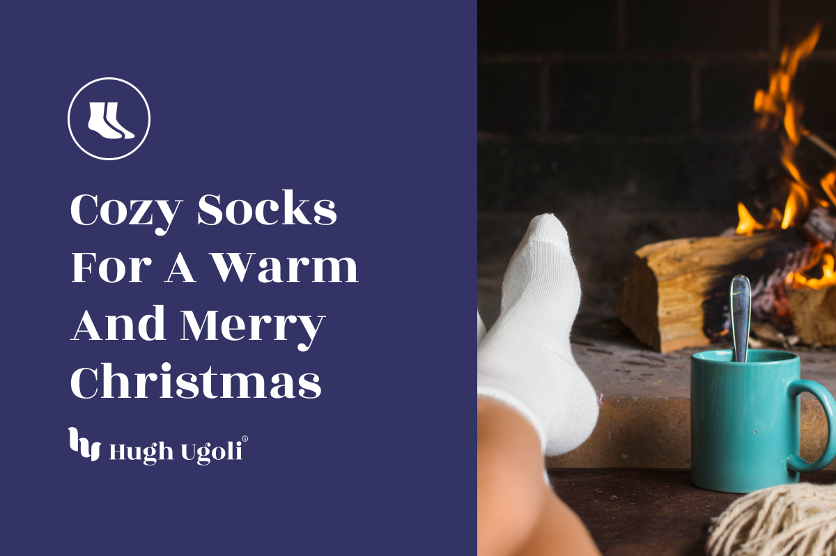 Feet in cozy white socks resting by a fireplace, with a warm drink in a teal mug, evoking a merry Christmas atmosphere.