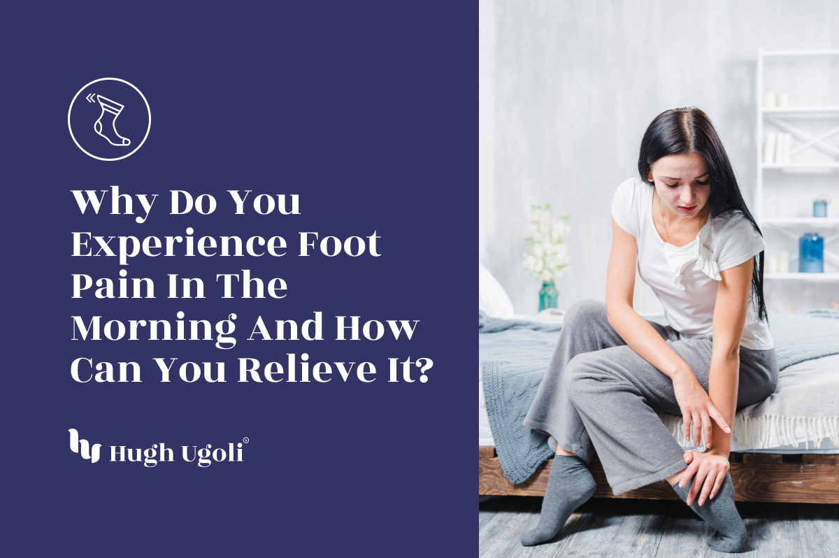 A woman sitting on the edge of her bed in the morning, wearing gray socks and holding her foot, possibly experiencing discomfort.
