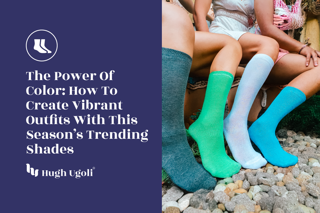 Three women sitting on a stone pathway, showcasing vibrant knee-high socks in shades of blue, green, and teal, embracing colorful fashion trends.