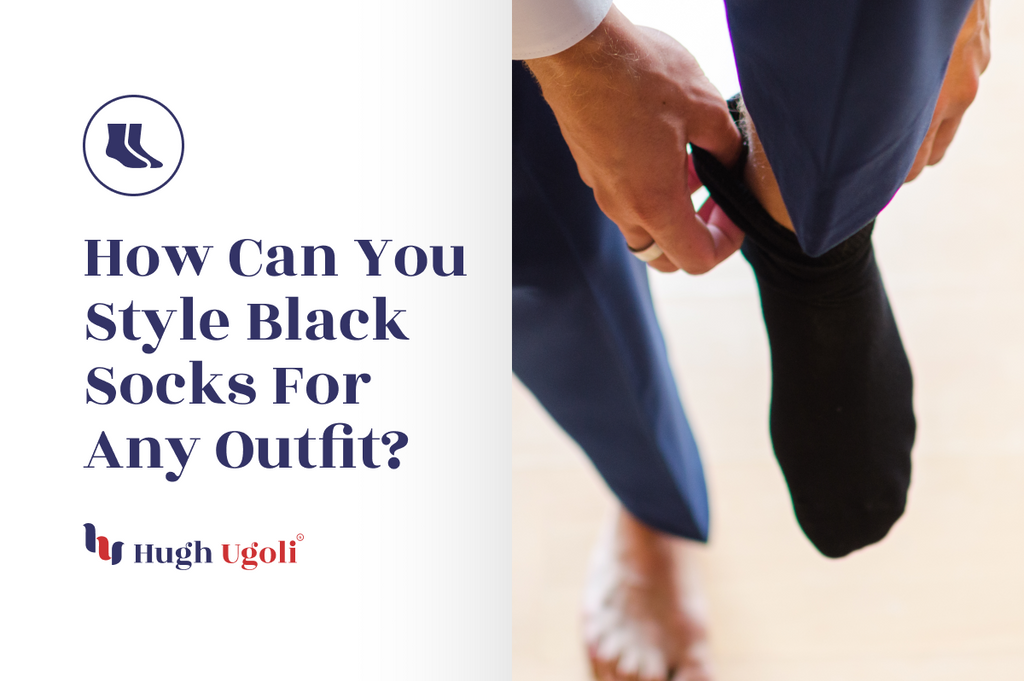 A man adjusting his black socks while wearing navy trousers, highlighting how black socks can complement various outfit styles for a sleek, polished look.