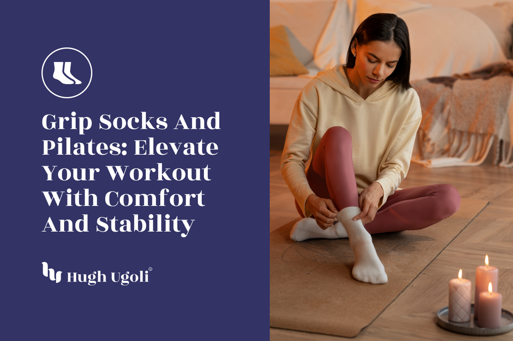 A woman sitting on a yoga mat in a cozy, candle-lit room, putting on grip socks, preparing for a Pilates session.
