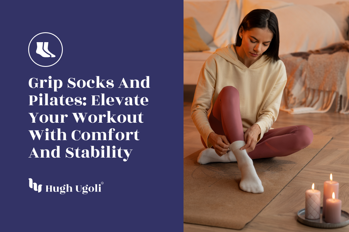 A woman sitting on a yoga mat in a cozy, candle-lit room, putting on grip socks, preparing for a Pilates session.