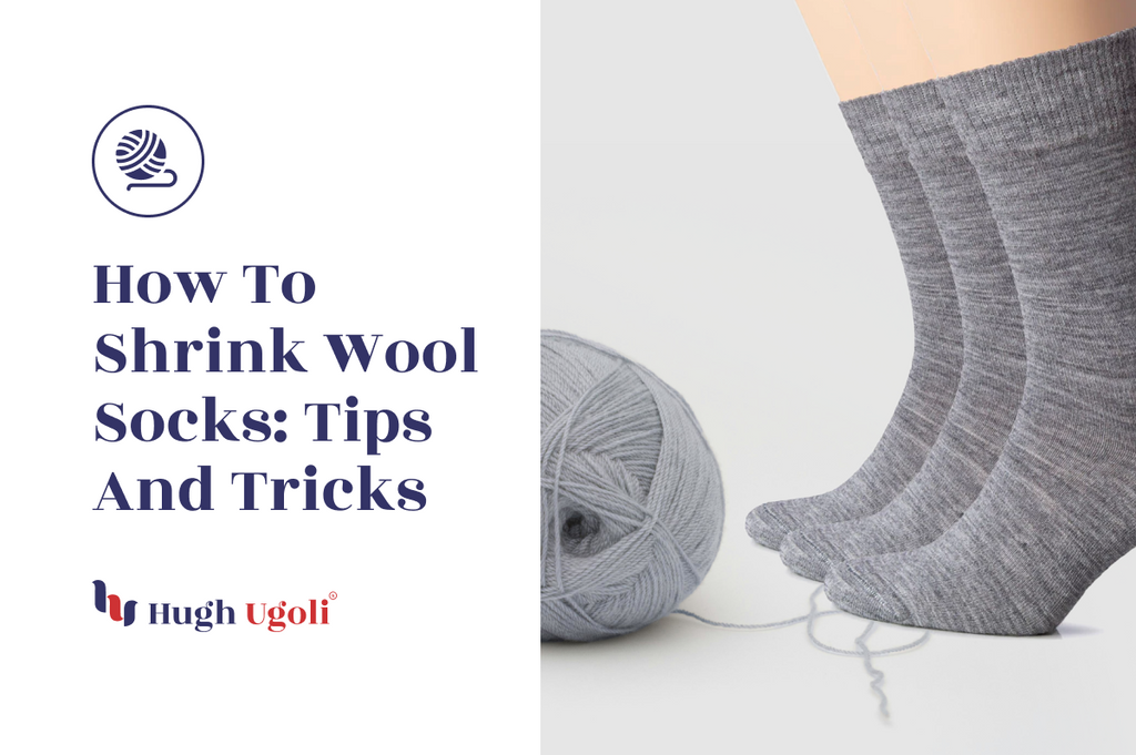 How to Shrink Wool Socks: Tips and Tricks - Hugh Ugoli. The image shows a pair of grey wool socks standing upright next to a ball of grey yarn on a white background.