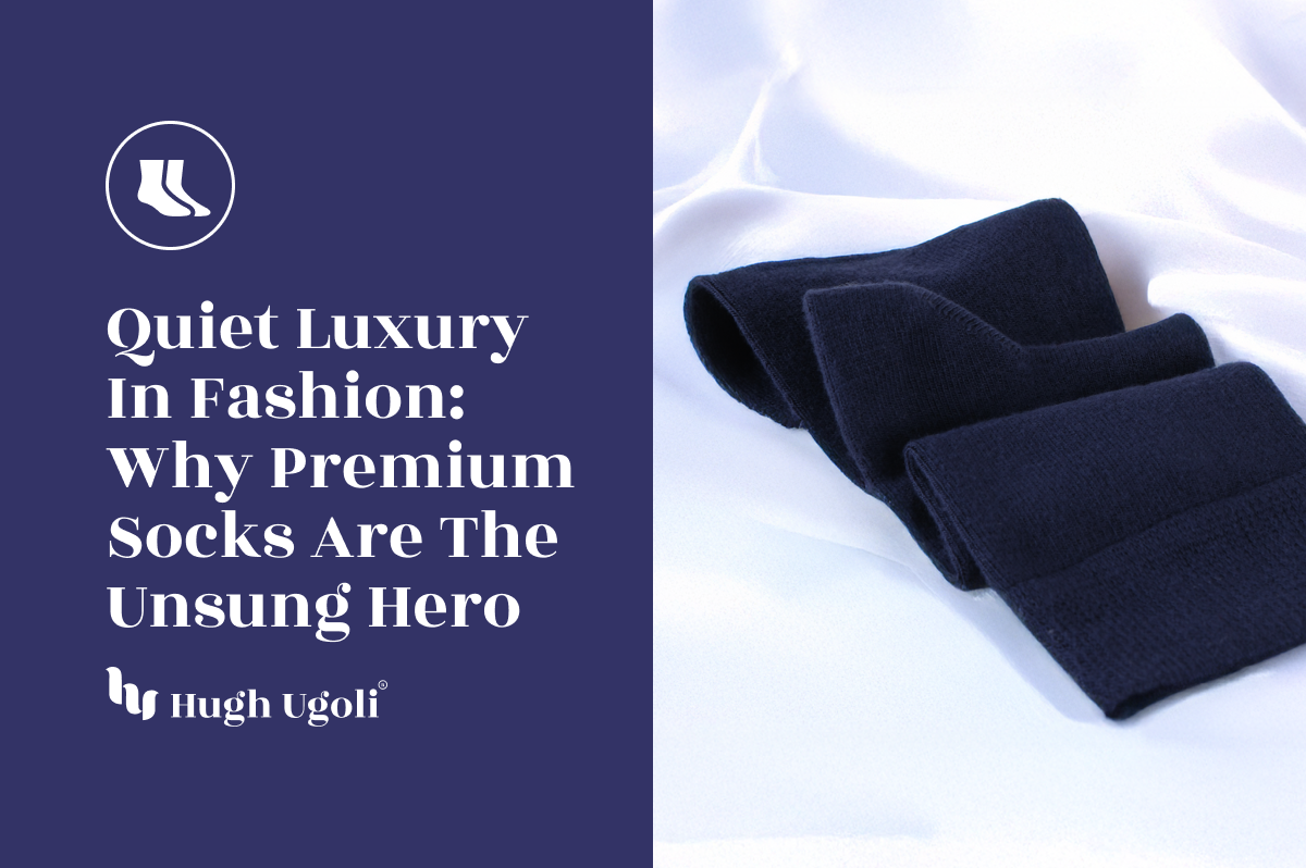 Pair of black socks on a white fabric background with text about premium socks.