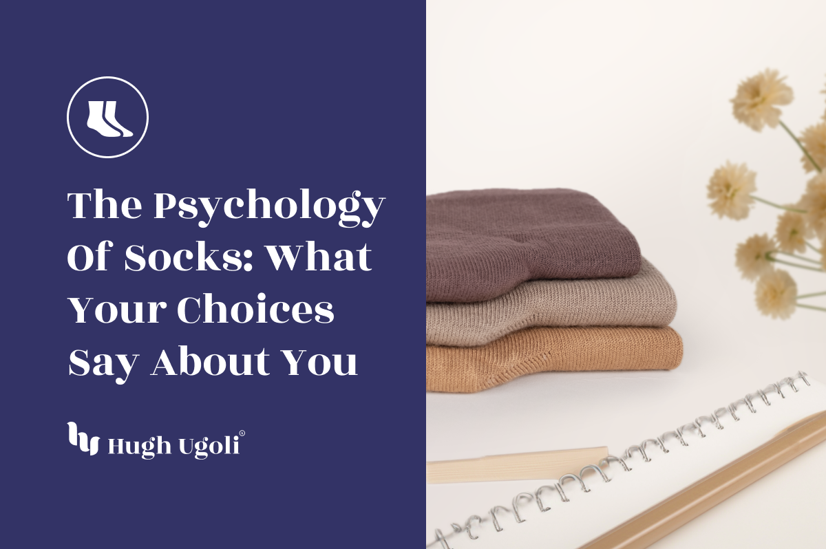 Stack of socks with a notebook and flowers on a white background, featuring text about sock psychology by Hugh Ugolf.