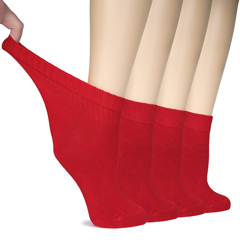 Step into comfort and style with these red socks! A woman's feet, adorned in soft and breathable bamboo fabric, are gently cradled by another pair of cozy red socks.- Hugh Ugoli
