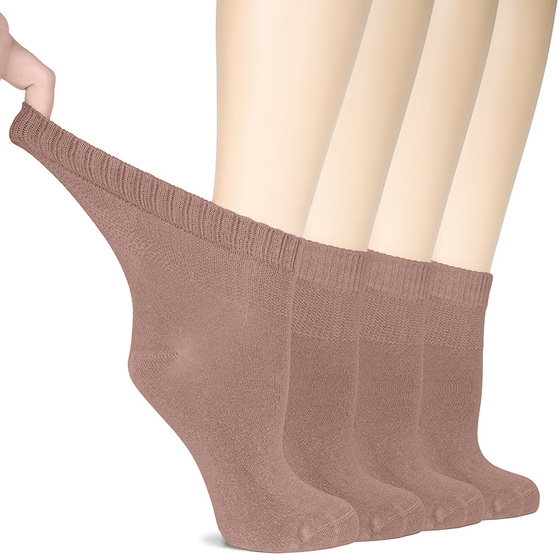Check out this image of a woman's foot holding up milk coffee socks! These Hugh Ugoli Lightweight Women's Diabetic Ankle Socks are a perfect blend of fashion and comfort. Made from soft bamboo fabric, they offer a seamless toe construction and a non-binding top for improved circulation. Plus, you get four pairs!- Hugh Ugoli