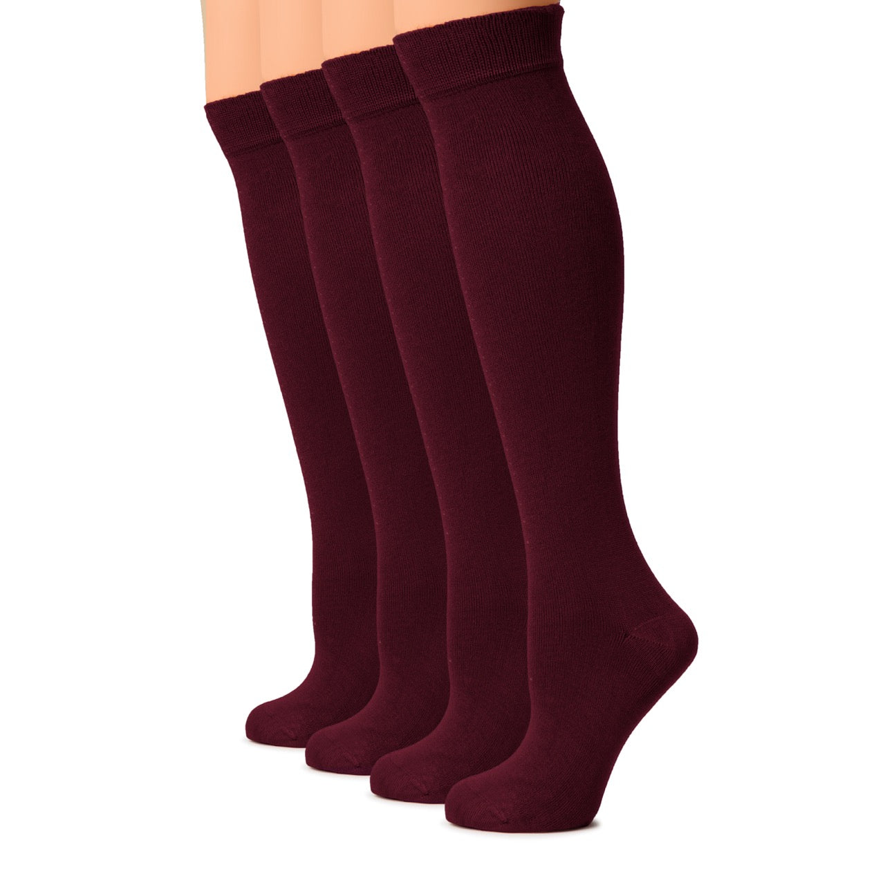 Set of four burgundy knee-high socks on a white background