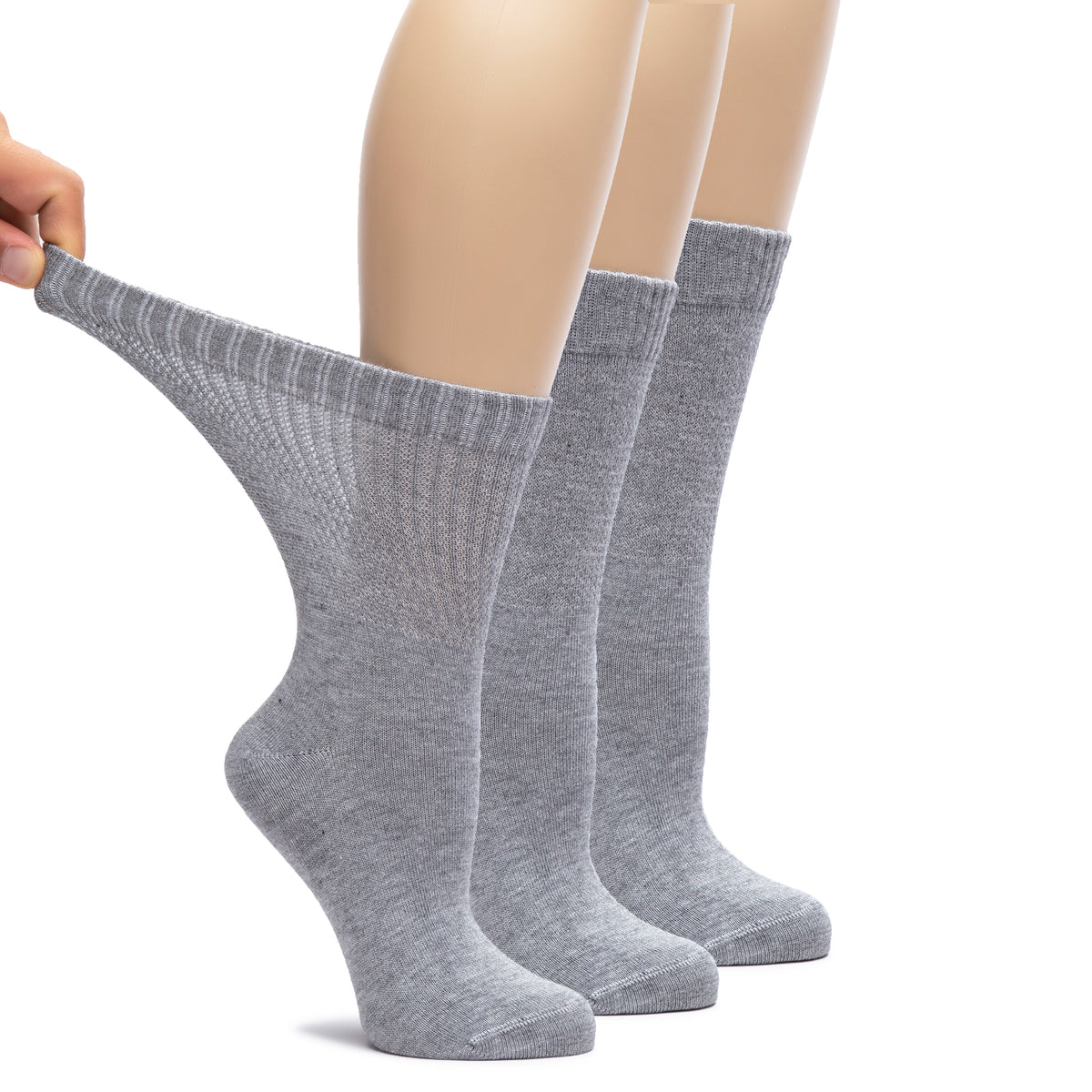  A trio of women's Bamboo Diabetic Crew Socks, each pair with one leg lifted, showcasing their soft and comfortable design.