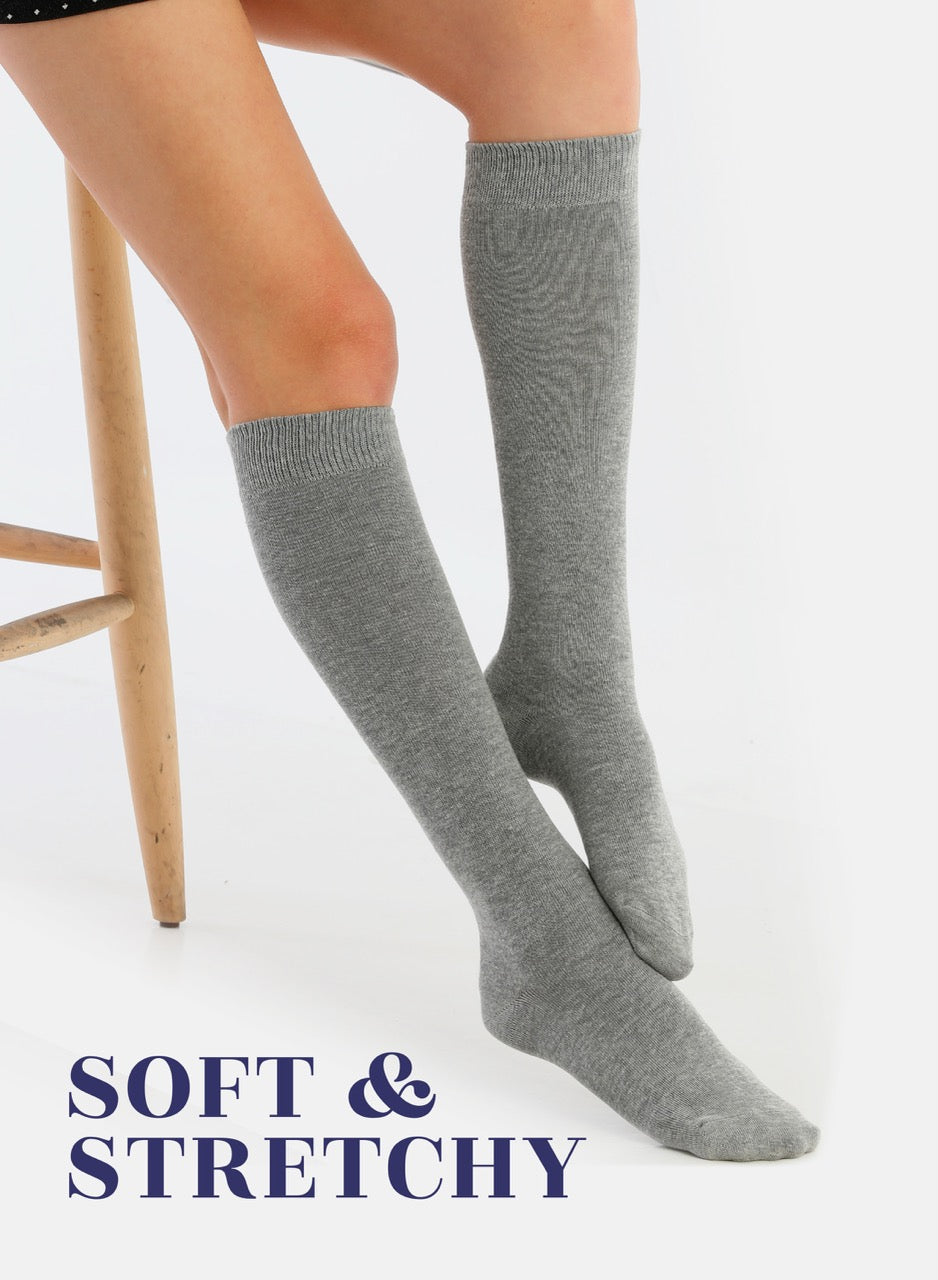 Gray knee-high socks worn by a person on a white background with 'Soft & Stretchy' text.