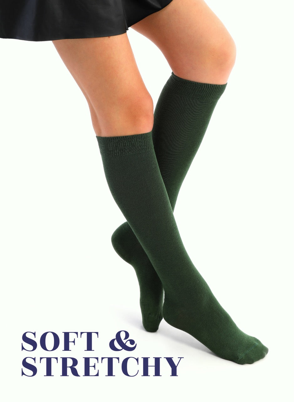 Green knee-high socks worn by a person on a white background with 'Soft & Stretchy' text.