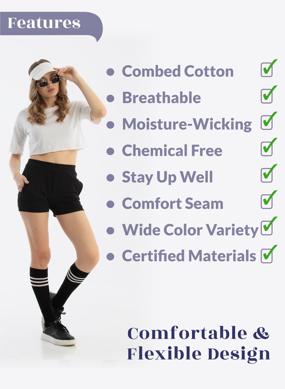Person wearing a white crop top, black shorts, and black socks with white stripes, standing against a white background with text listing product features.