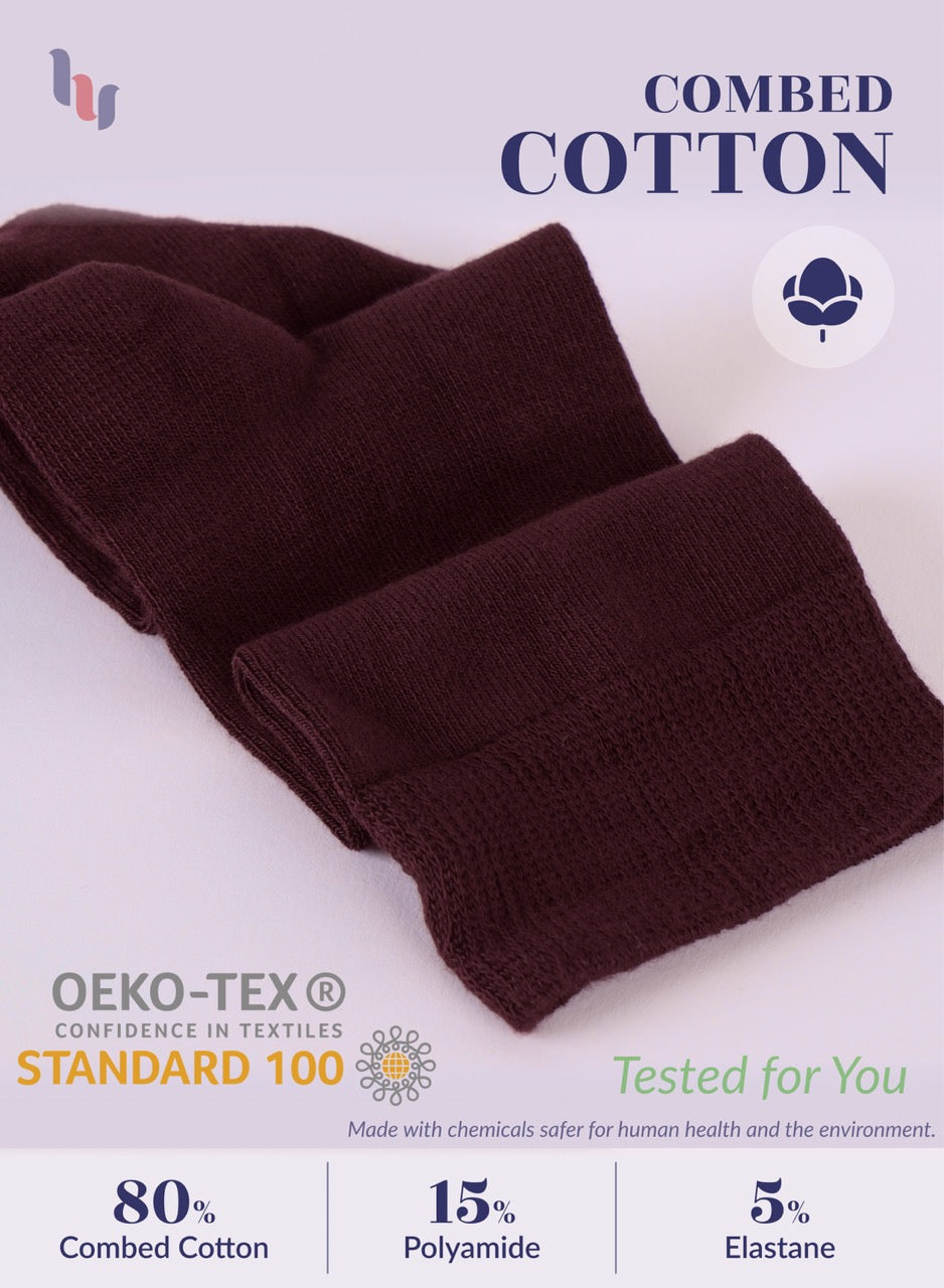 Brown fabric with OEKO-TEX and Combed Cotton text on a light purple background