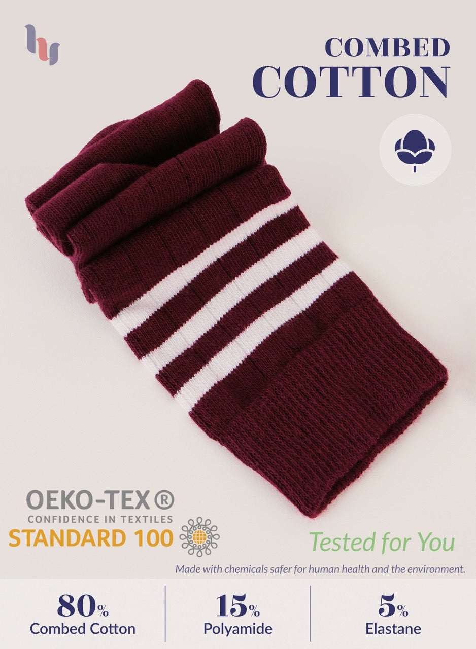Maroon and white striped knit sleeve with text about combed cotton and OEKO-TEX certification on a light beige background.