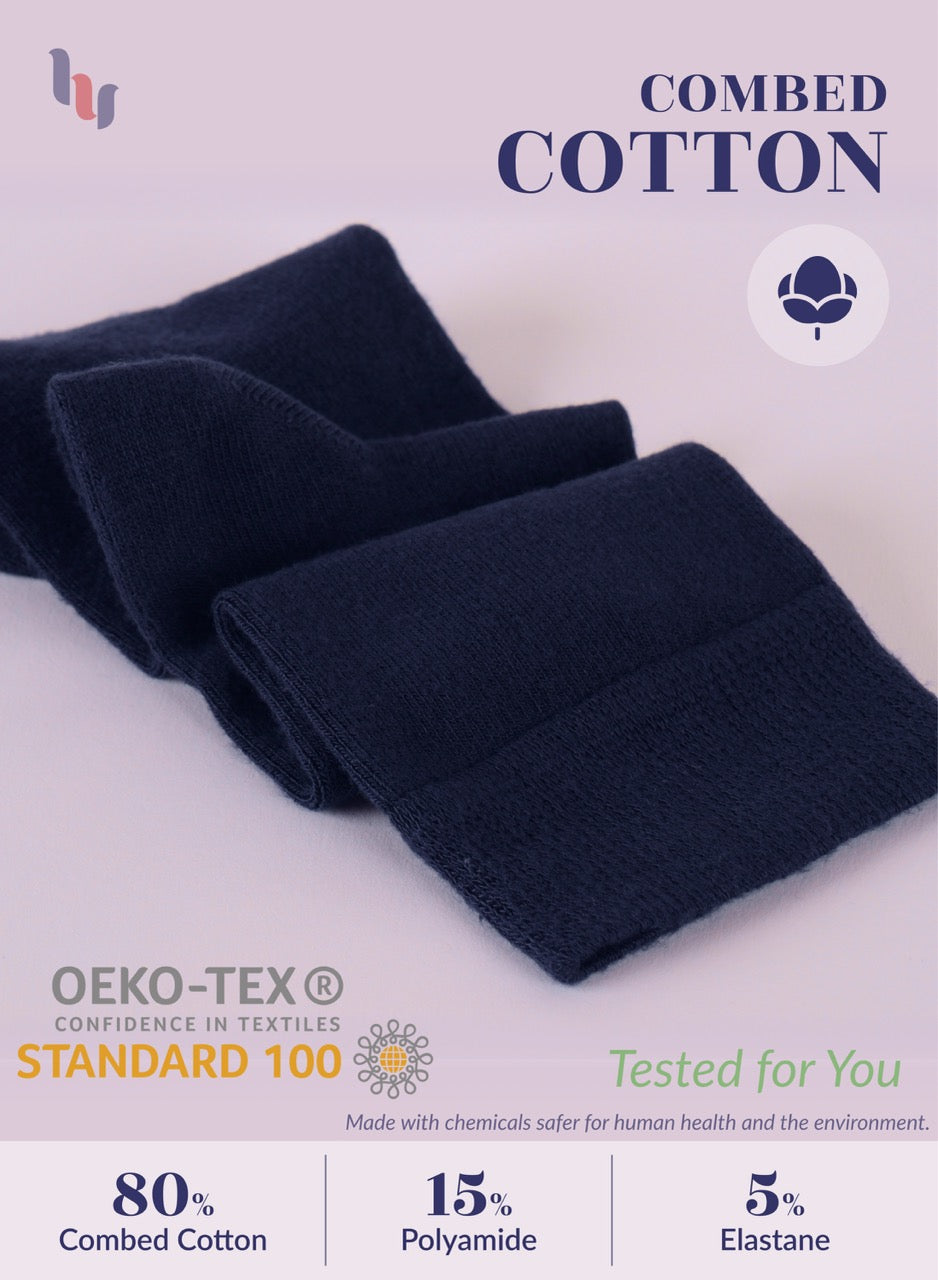 Dark blue fabric with text about combed cotton, OEKO-TEX Standard 100, and fiber content on a light background.