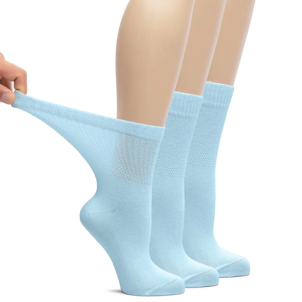 Sky blue socks being stretched on a white background