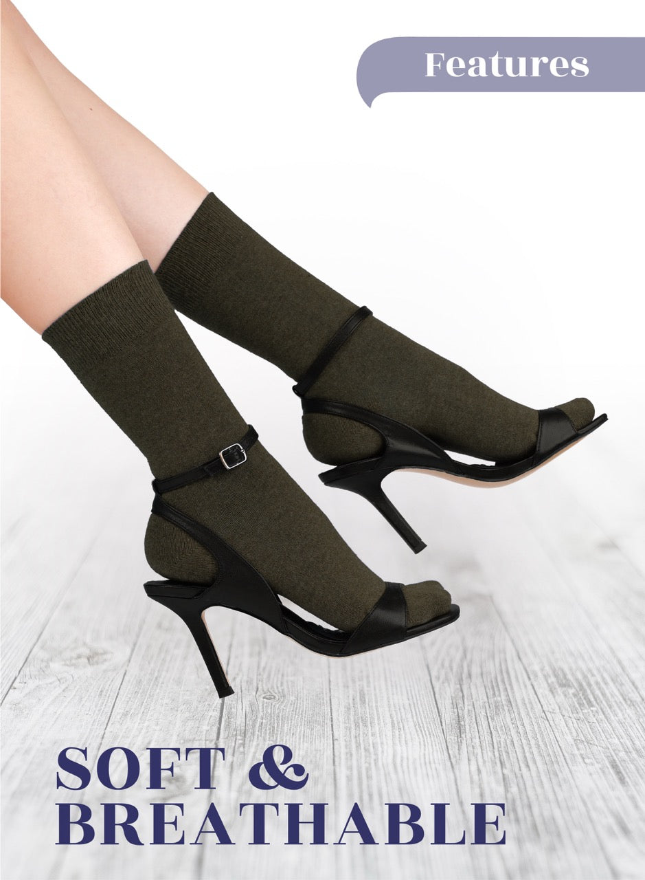 Army Green high-heeled shoes with brown socks on a light wooden floor, featuring text 'Soft & Breathable'.