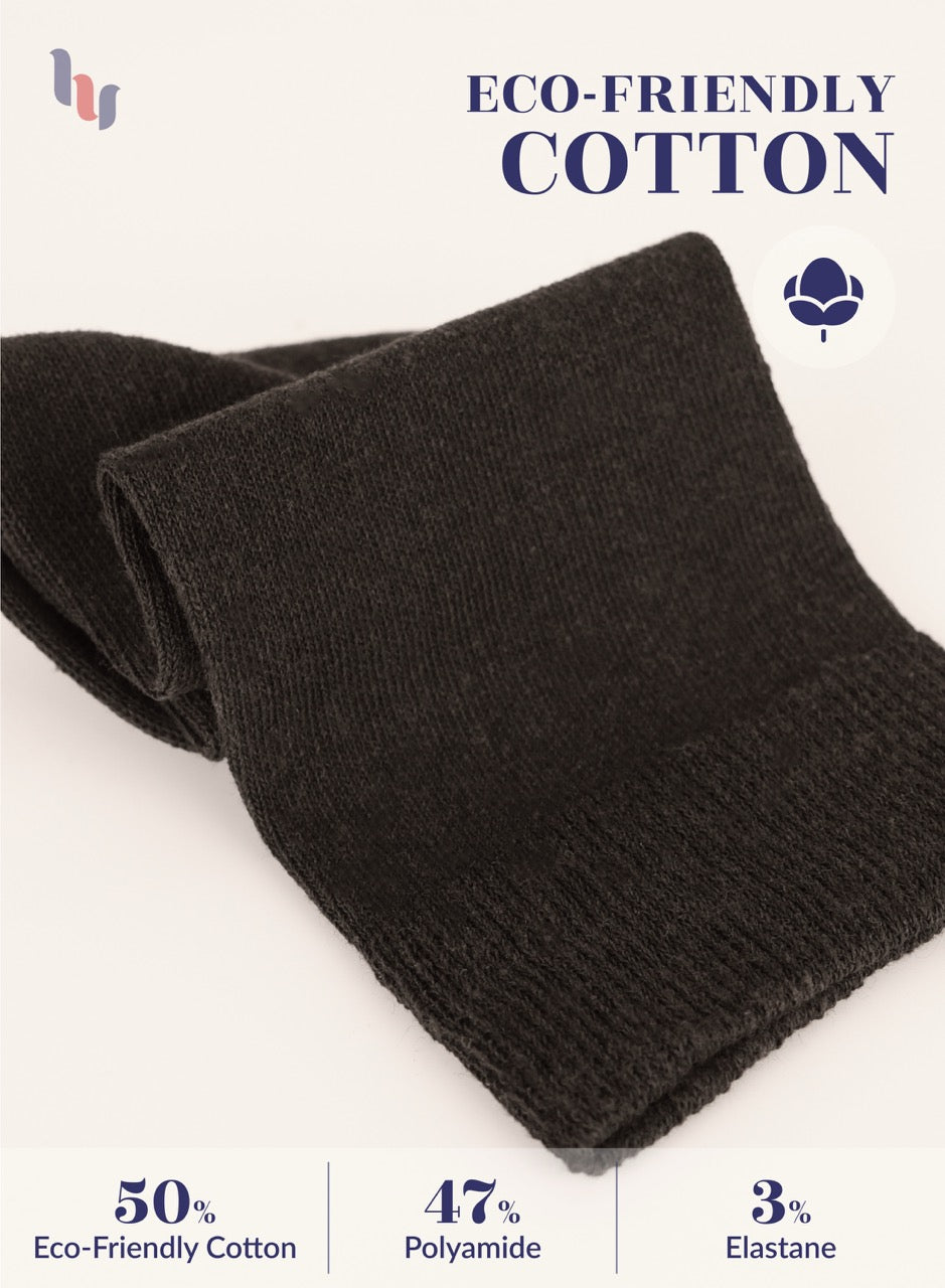 Black fabric with eco-friendly cotton label on a white background