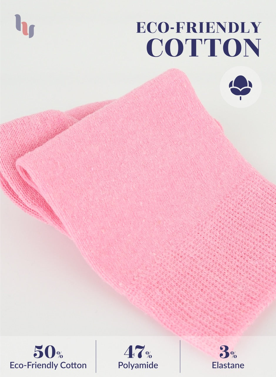 Pink fabric with eco-friendly cotton label on a light gray background