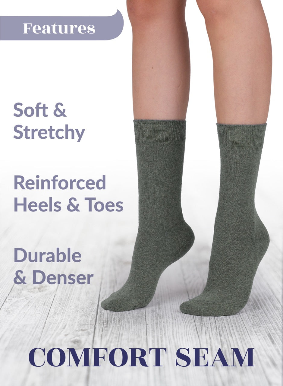 Gray socks with text highlighting features on a light wooden floor background