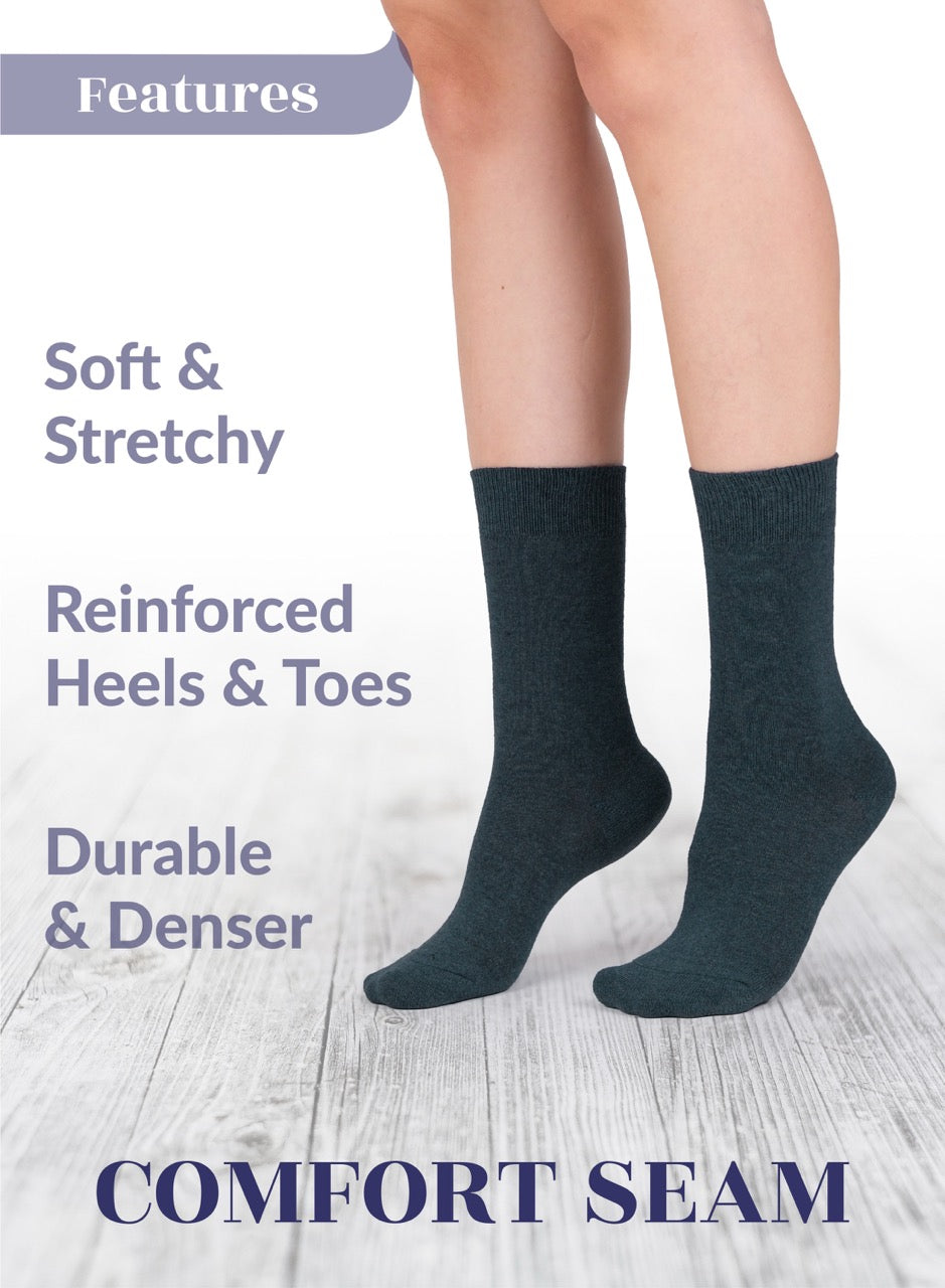 Dark gray socks with text highlighting features on a light wooden floor background