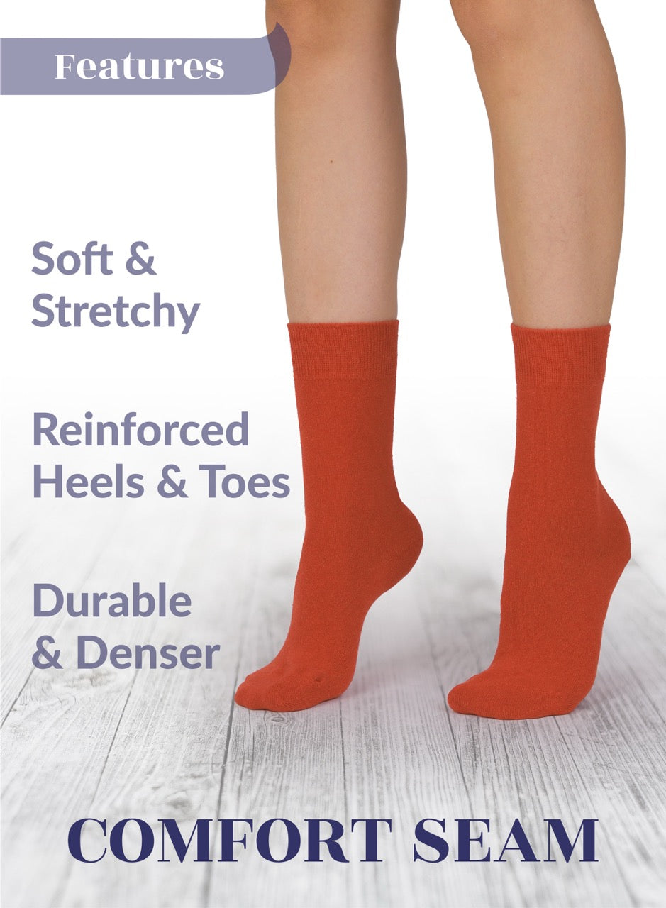 Orange socks with text highlighting features on a white background