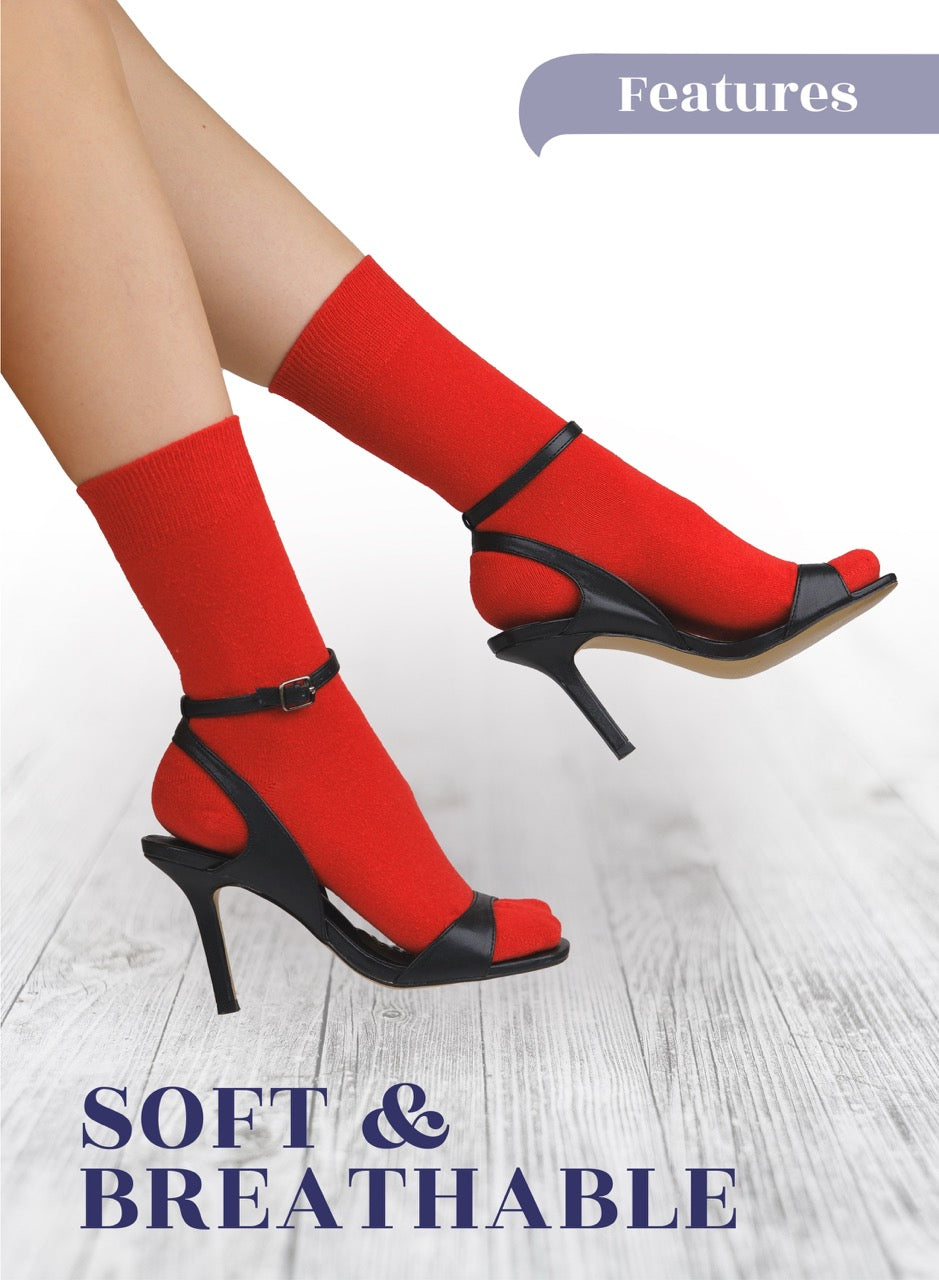 Red socks with black high heels on a light wooden floor, with 'Features' and 'Soft & Breathable' text.