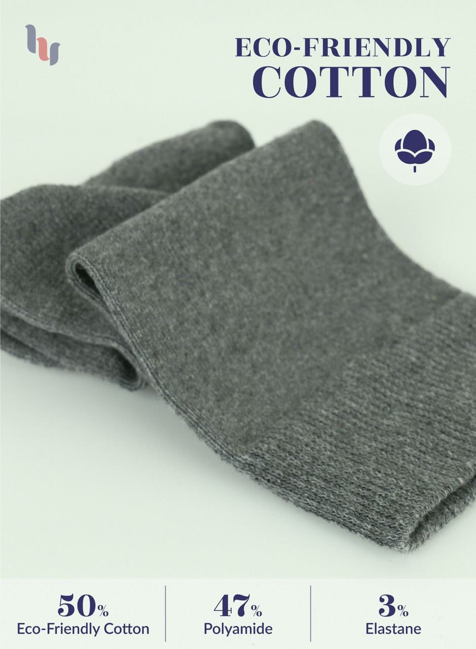 Folded gray fabric with eco-friendly cotton label on a white background