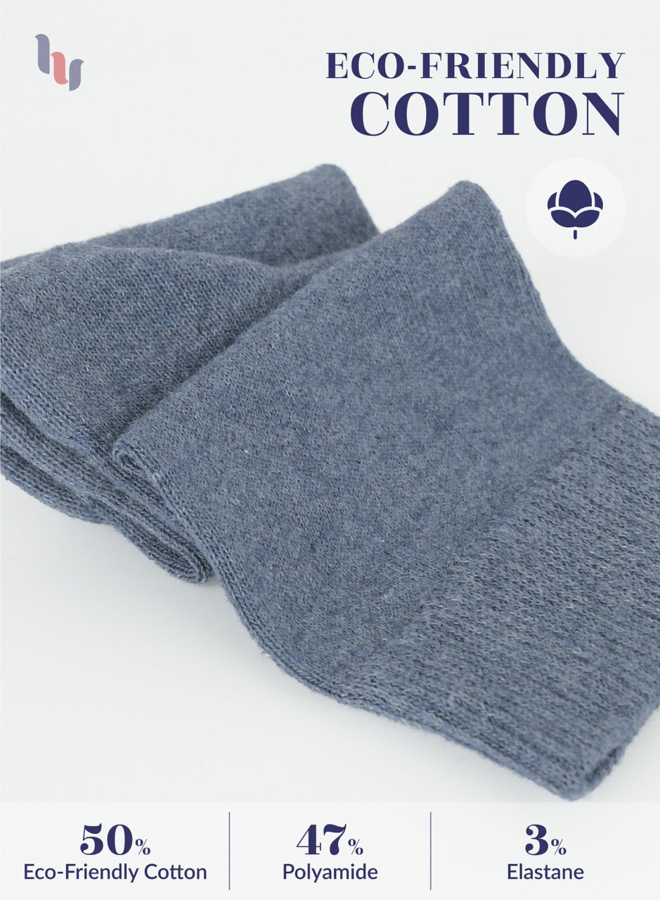Indigo blue socks with eco-friendly cotton label on a white background