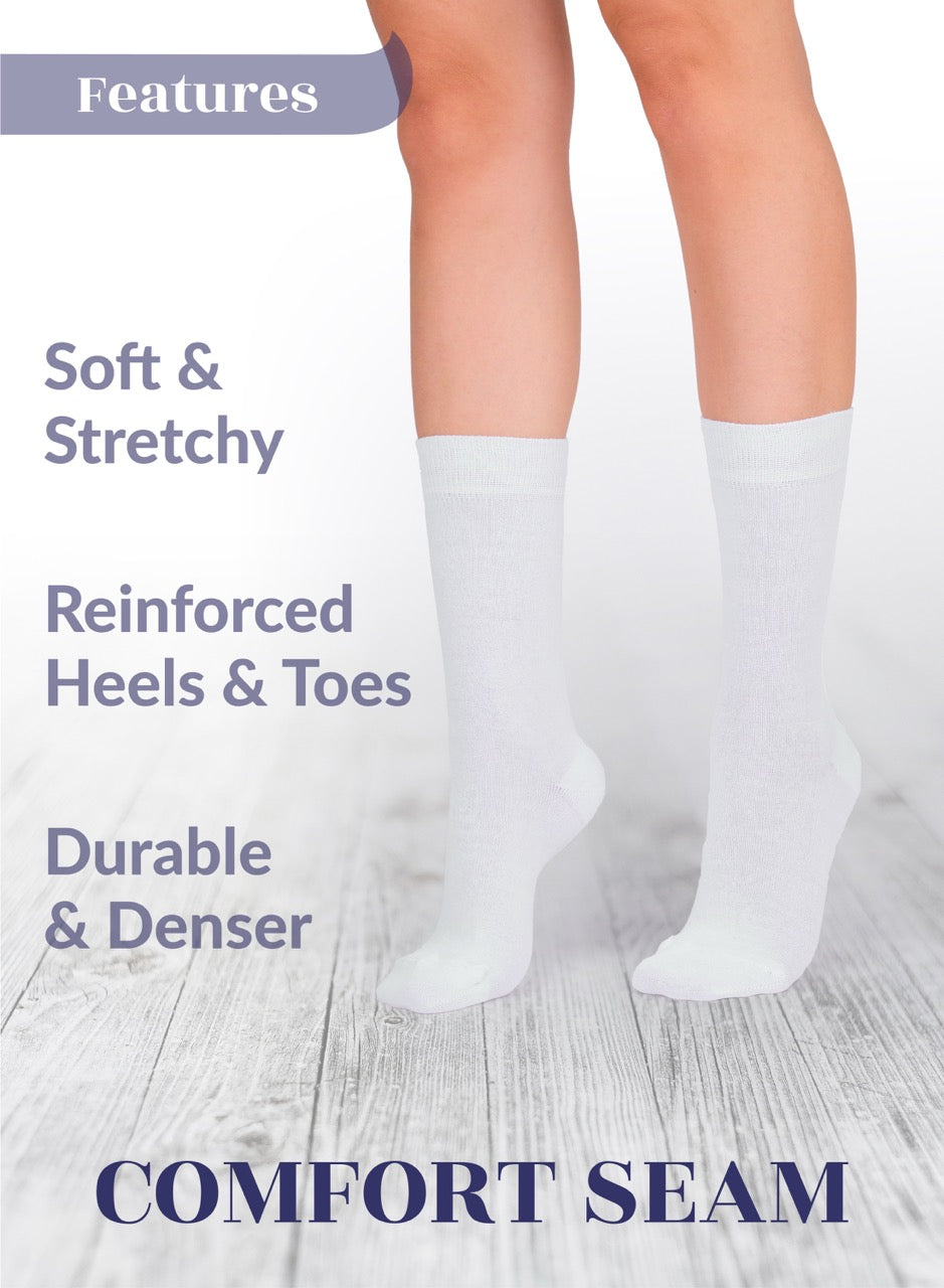 White socks with text highlighting features on a light wooden floor background
